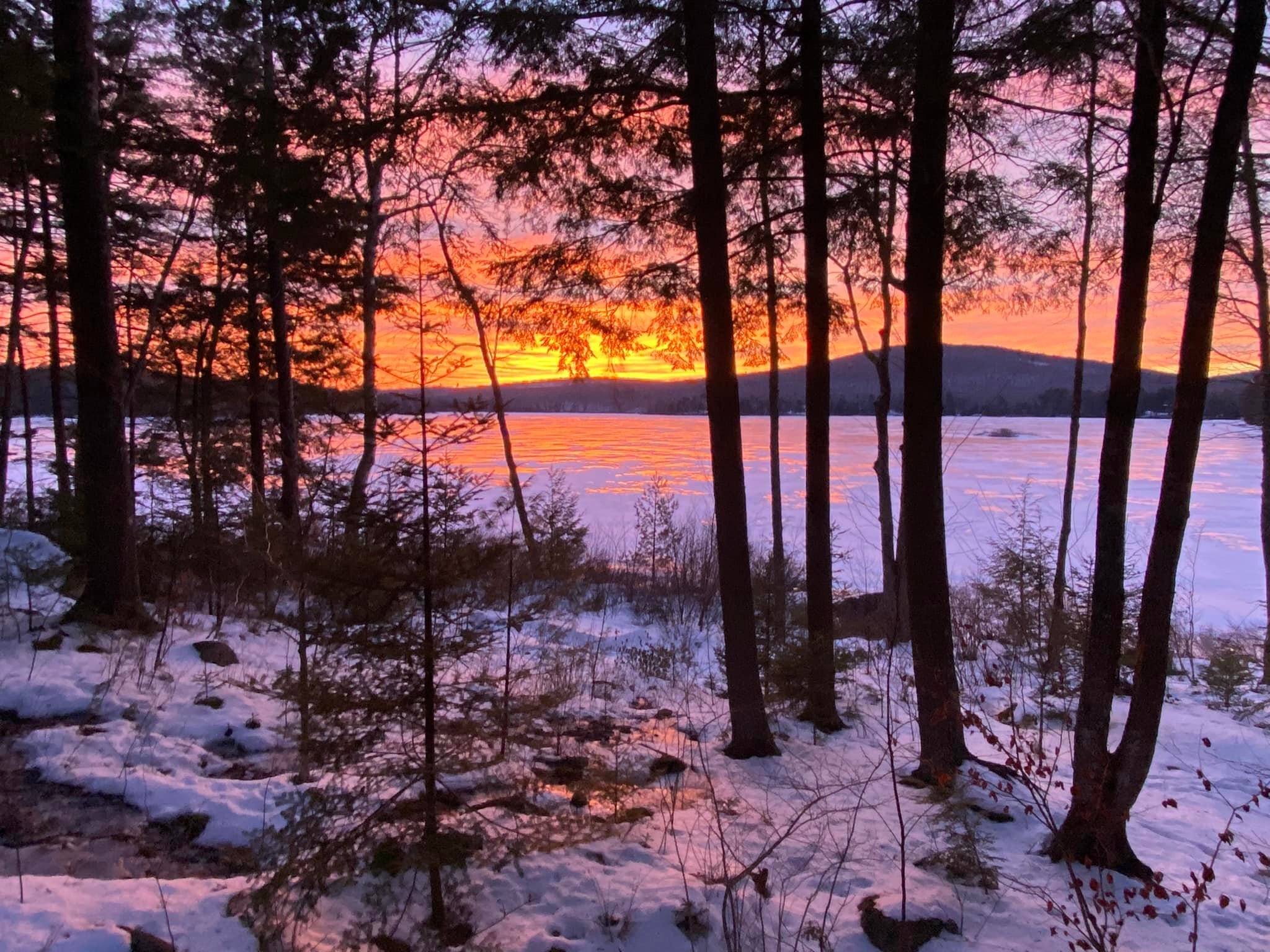 Rocky Pond in Downeast Maine during a stunning winter sunset